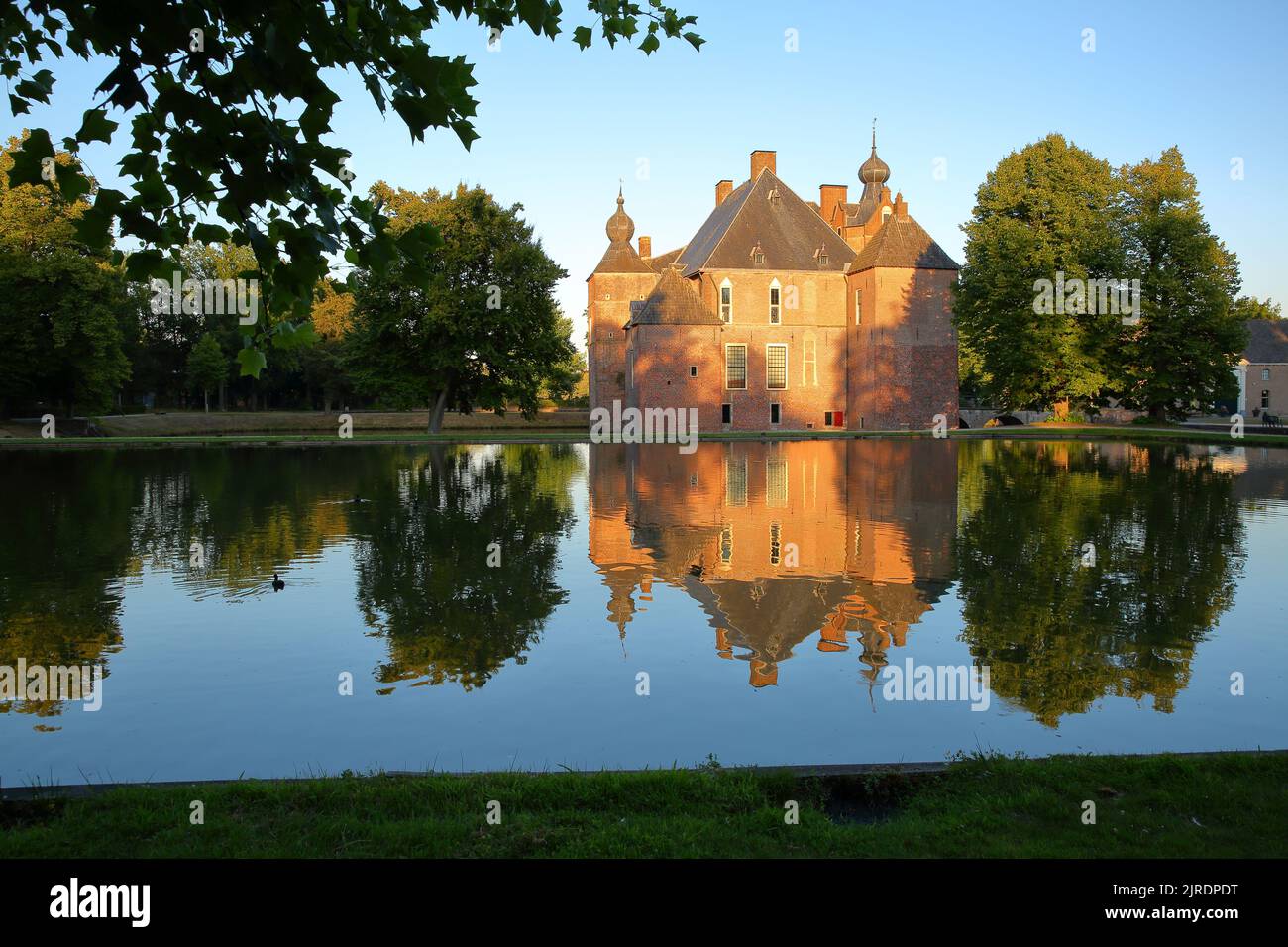 VAASSEN, GELDERLAND, NETHERLANDS - AUGUST 12, 2022: Reflections of Cannenburch Castle, a medieval castle (dated from 18 century) with its park Stock Photo