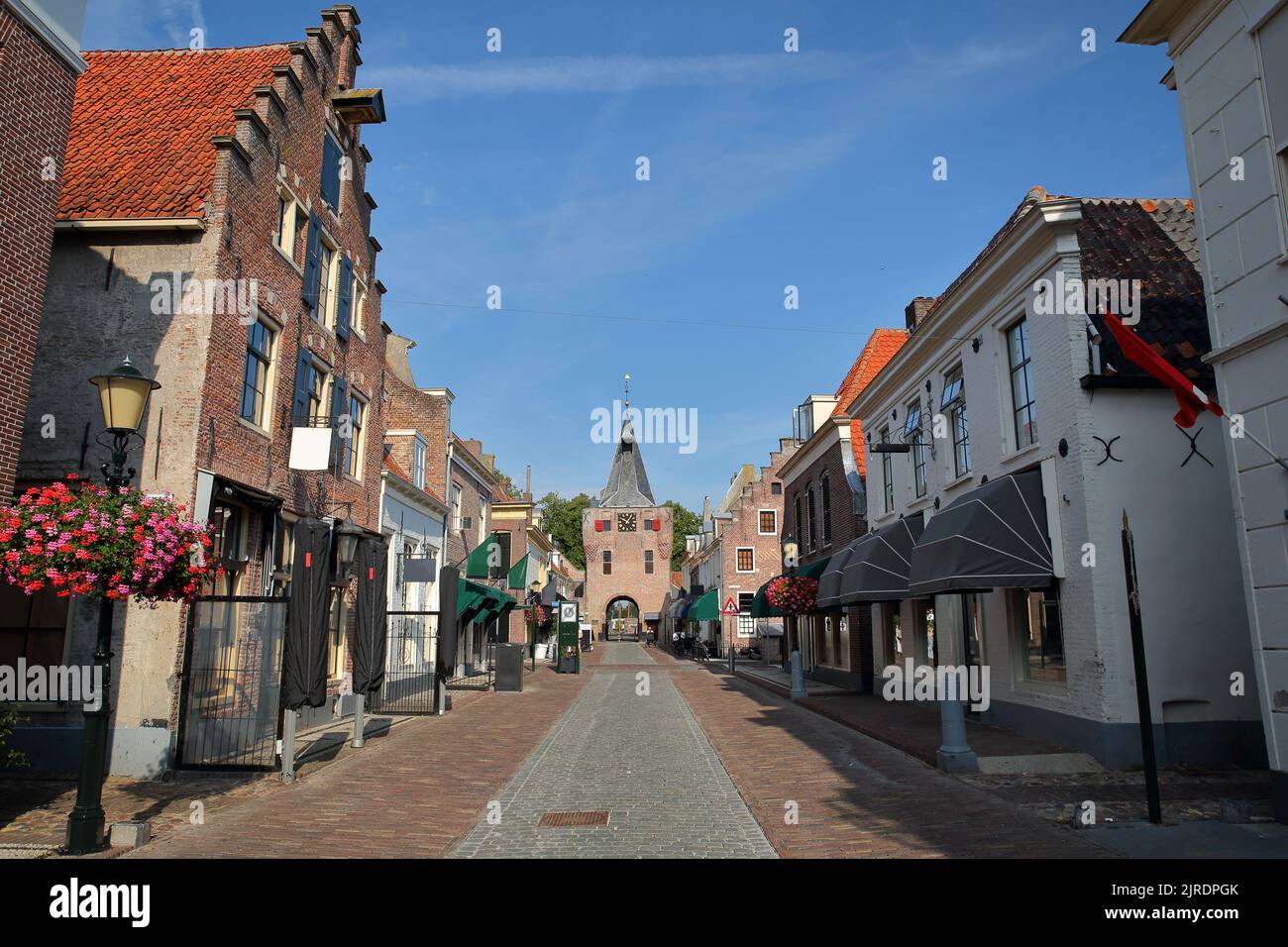 Traditional historic medieval houses along the main street (Vischpoortstraat) in the old picturesque fortified town of Elburg, Gelderland, Netherlands Stock Photo