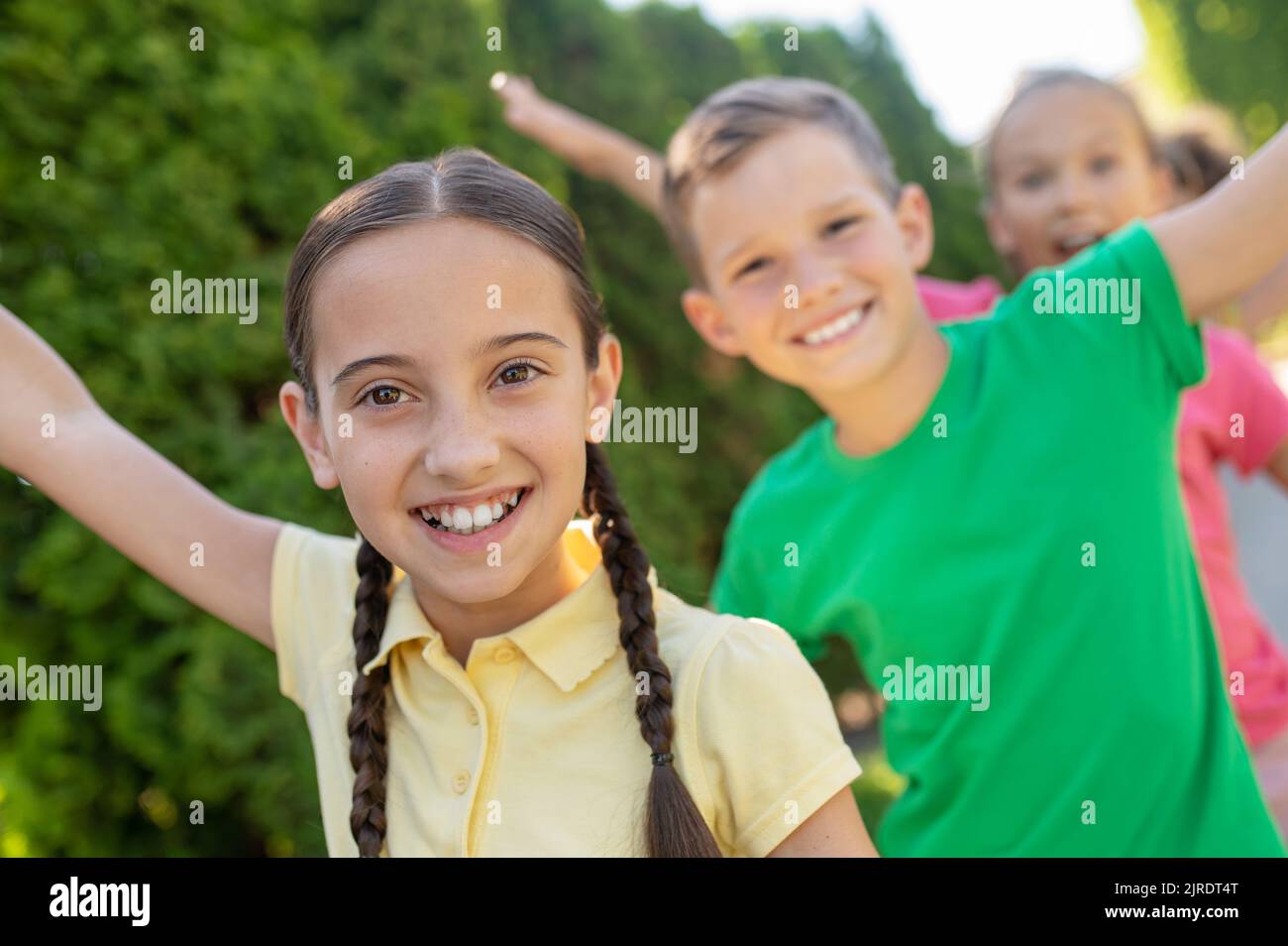 Girls and boys having fun outdoors Stock Photo Alamy
