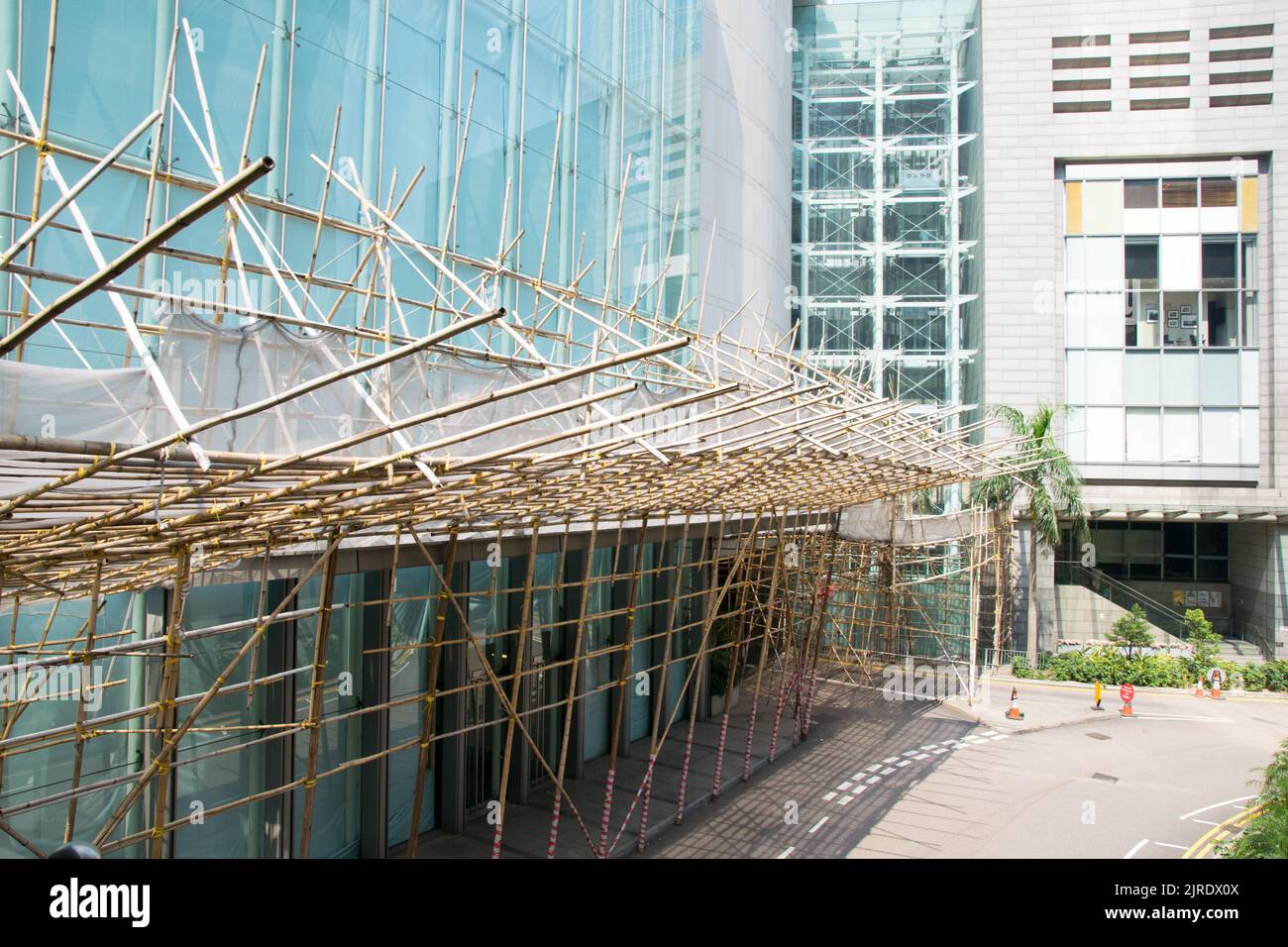 Bamboo scaffolding attached to an office building in Hong Kong. Stock Photo