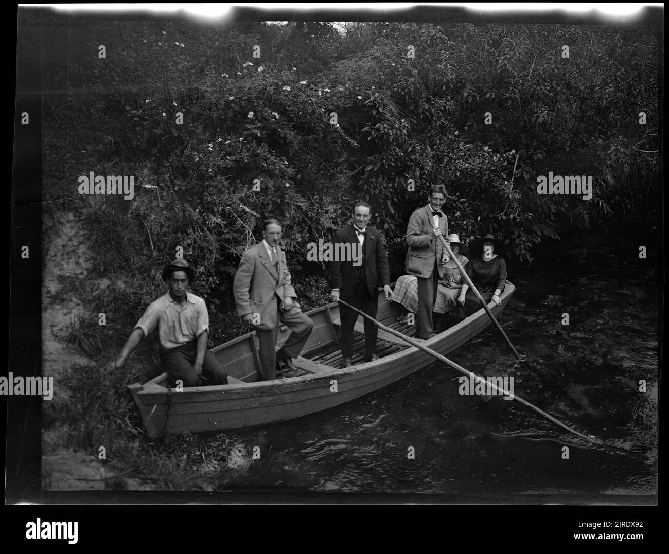 Six people in a dinghy, 19221923, North Island, maker unknown Stock