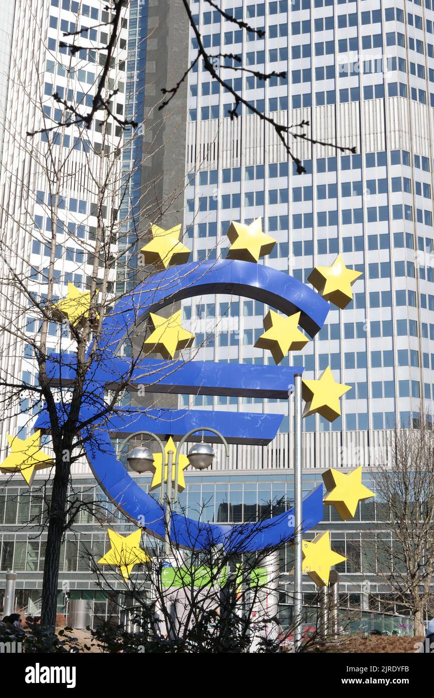 A vertical shot of the Euro sign in front of the central bank building in Frankfurt am Main, Germany Stock Photo