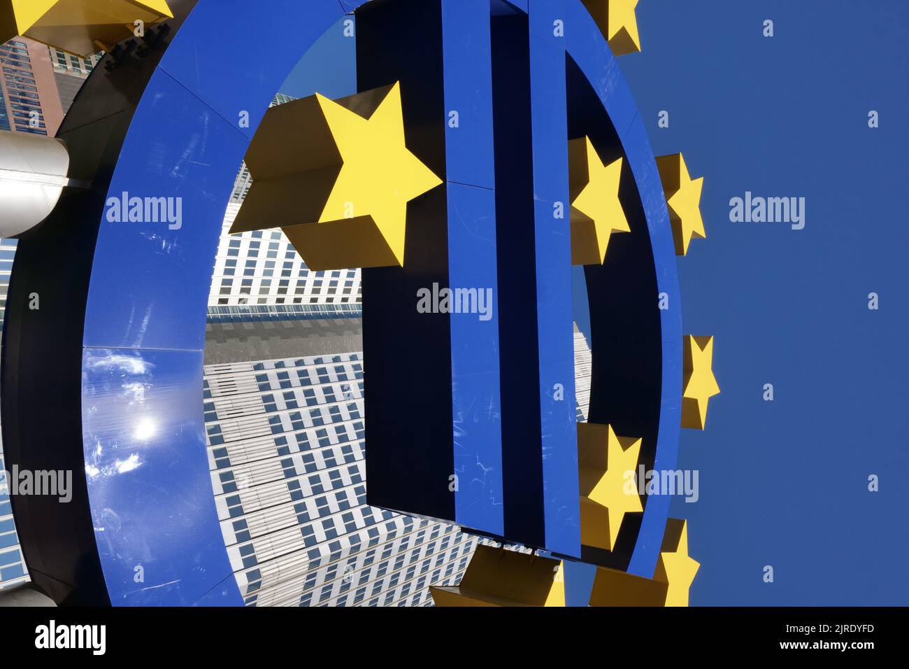 A low angle shot of the Euro sign in front of the central bank building in Frankfurt am Main, Germany Stock Photo