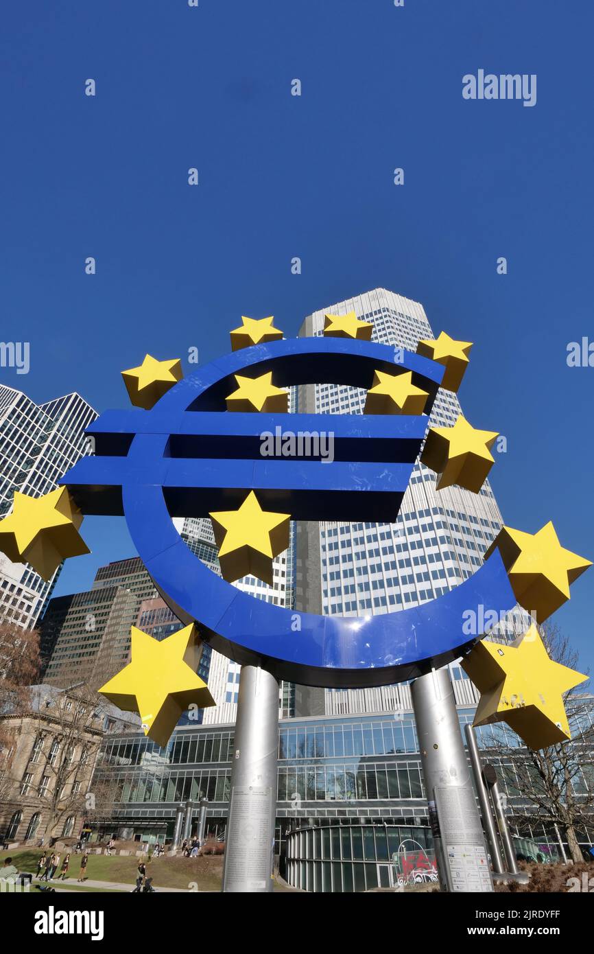 A vertical shot of the Euro sign in front of the central bank building in Frankfurt am Main, Germany Stock Photo