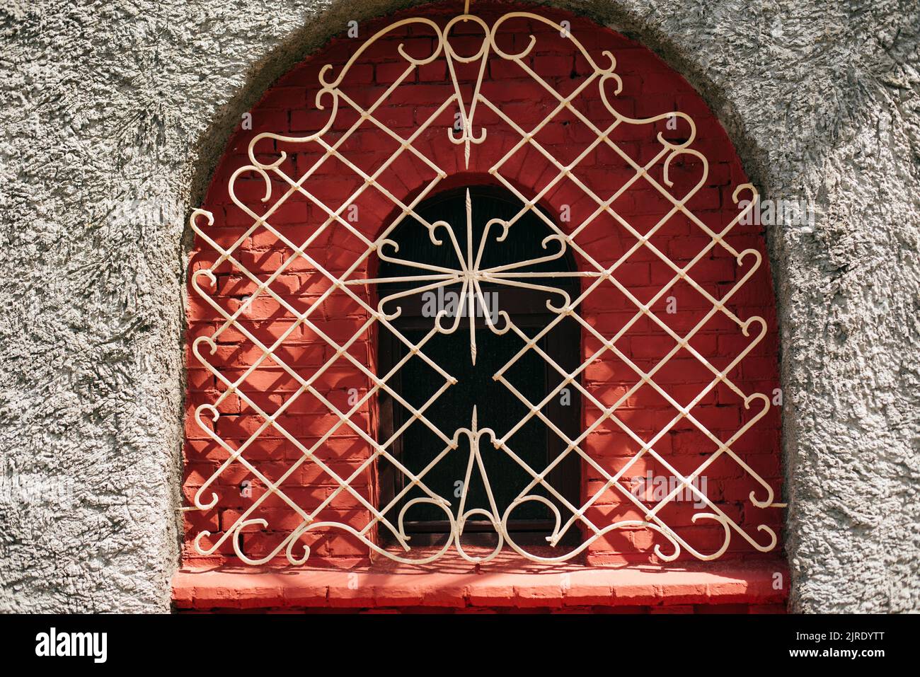False windows with a decorative frame and metal bars Stock Photo Alamy