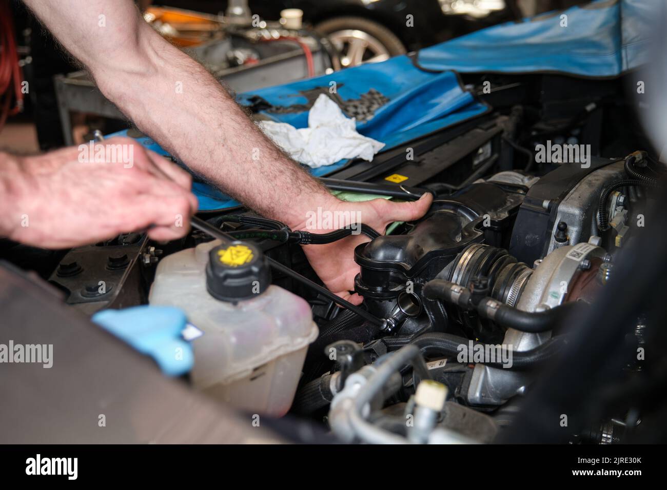 Car mechanic hands replacing engine throttle body Stock Photo Alamy