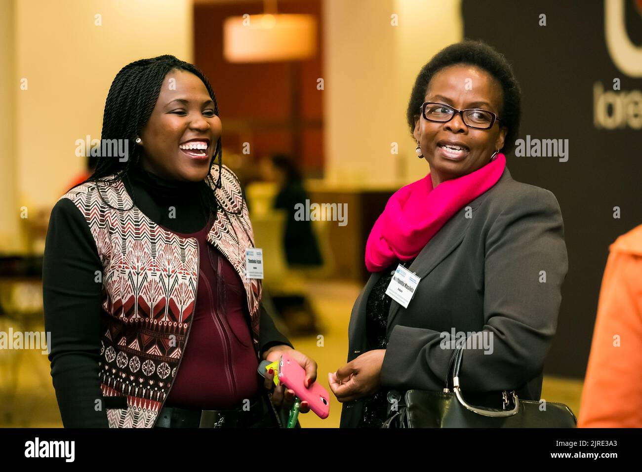 Johannesburg, South Africa July 14, 2014 Diverse woman networking at corporate convention