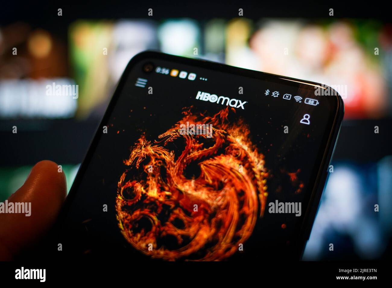 The HBO Max app is seen running on a mobile phone in this photo ...