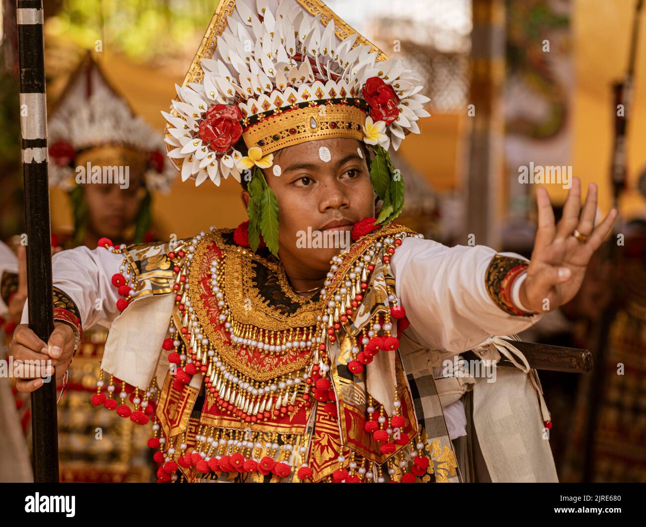 Young man dances at the temple on Galungan Day in Bali. Stock Photo