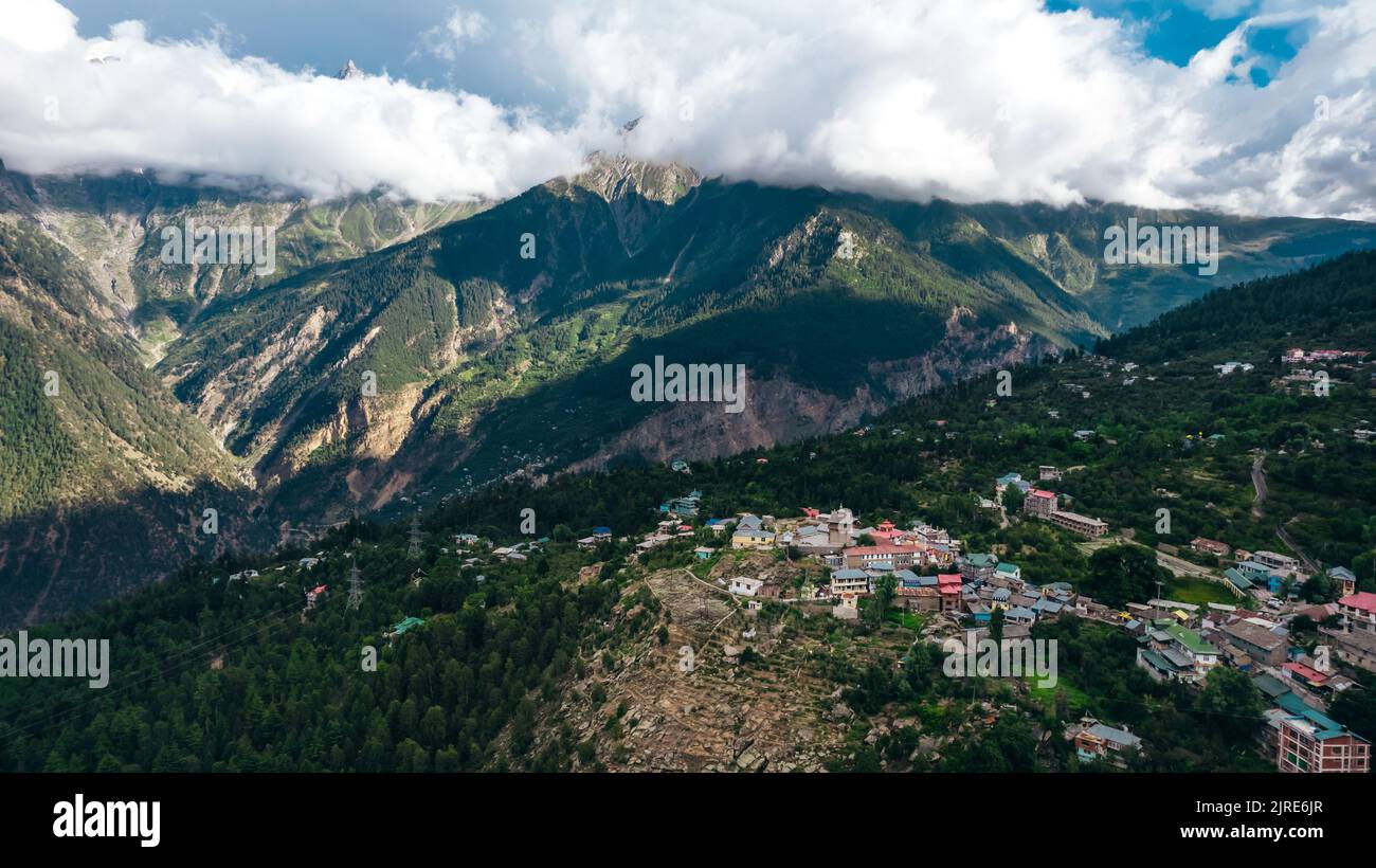 Kalpa Village with Himalayan Mountain peaks at sunset in Himachal Pradesh India, aerial Stock Photo