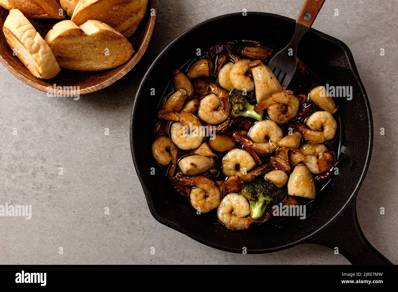 Garlic and peperoncino flavored olive oil. food with shrimp. spanish food culture Stock Photo