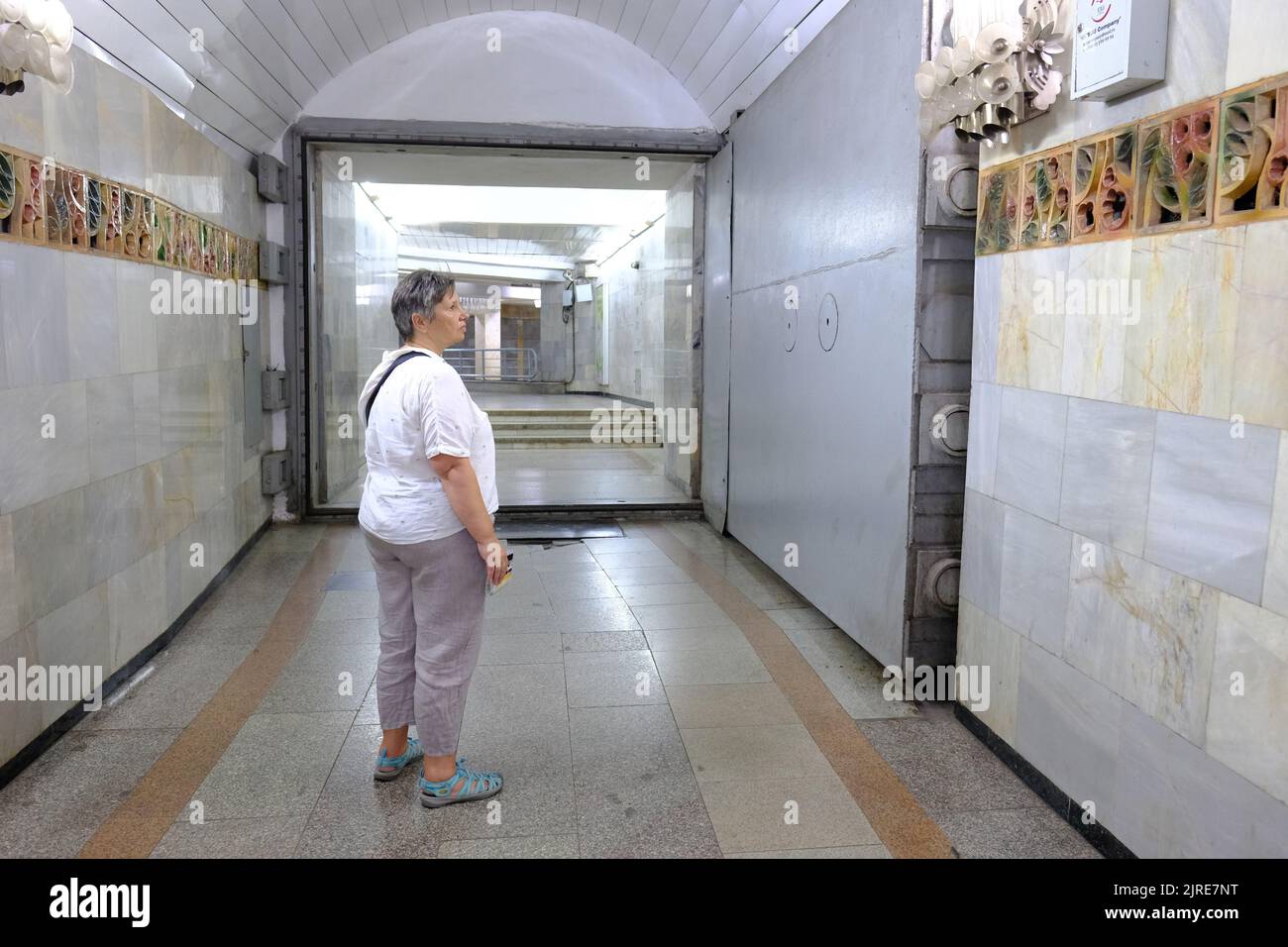 Tashkent Uzbekistan a visitor looks at a huge steel nuclear bomb blast proof door at a Tashkent Metro underground station Stock Photo