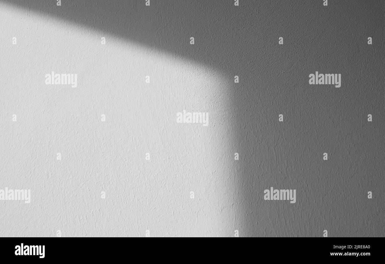 Abstract pattern of shadows by sunny beams on a wall as  texture or background Stock Photo