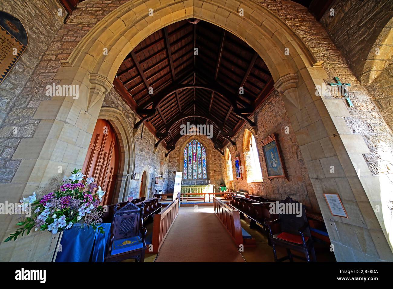 Newbiggin by the sea Northumberland beautiful seaside village with 13th century St Batholomews church interior view looking east towards the superb Ea Stock Photo