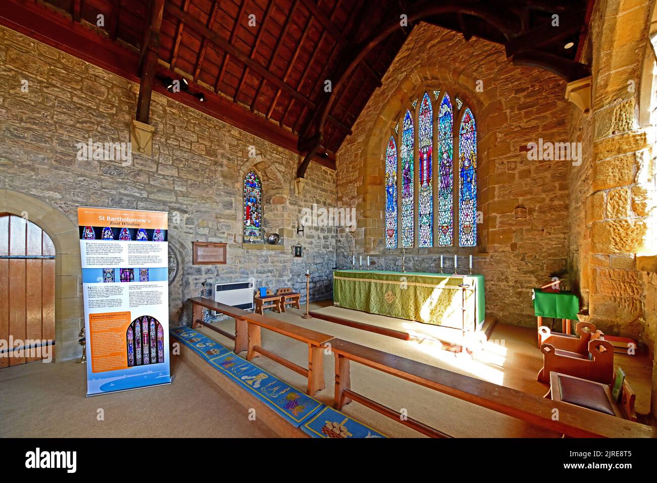Newbiggin by the sea Northumberland beautiful seaside village with 13th century St Batholomews church interior view looking east towards the superb 14 Stock Photo