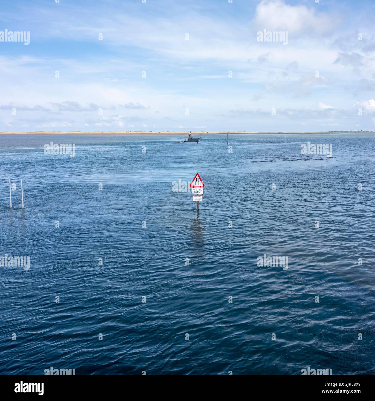 holy island causeway road sign and refuge at high tide daytime no people Stock Photo
