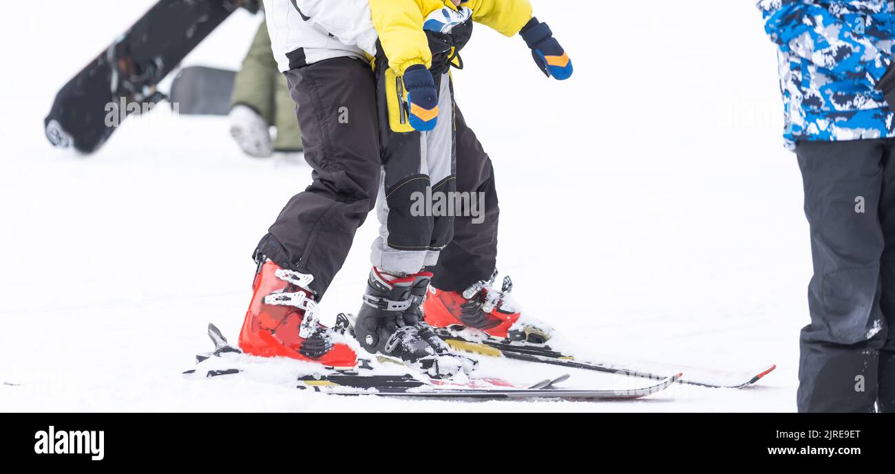 skiing master class for kids with instructor in winter sports school
