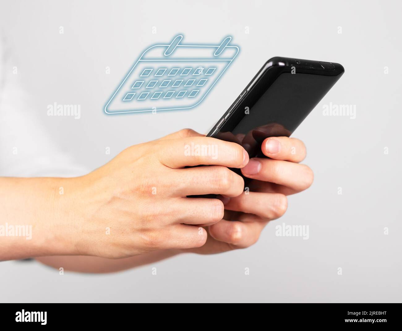 Woman using planner calendar on phone. Mobile daily planning app. Hands ...