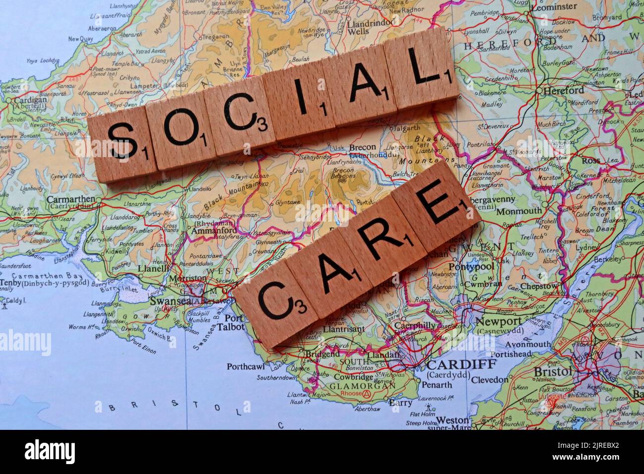 Health & social care in Wales, spelled out in letters, on map of Newport,Cardiff,Swansea,Barry,Bridgend Stock Photo