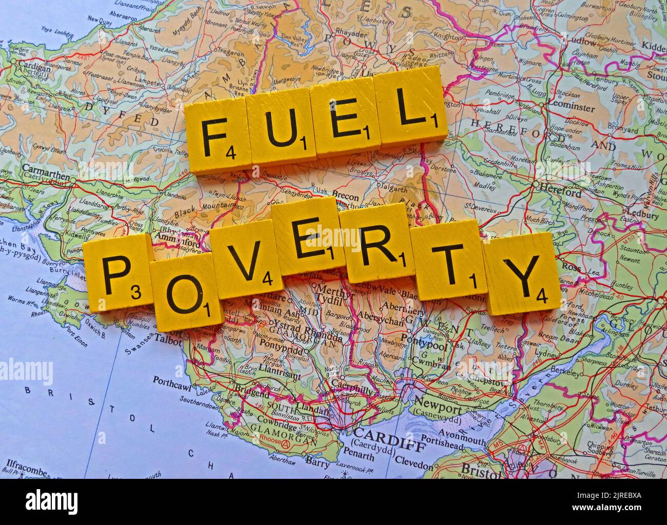 Wales Map, with words Fuel Poverty spelled out. More than half of UK households across Britain will choose to eat or heat Stock Photo