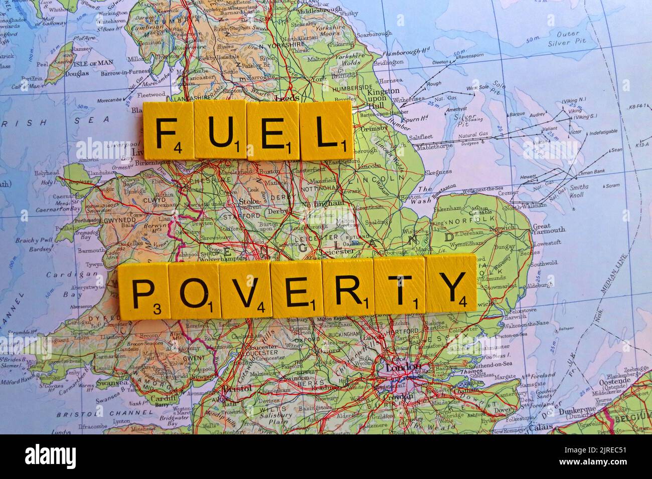 Map showing England, with words Fuel Poverty spelled out. More than half of UK households across Britain will choose to eat or heat Stock Photo
