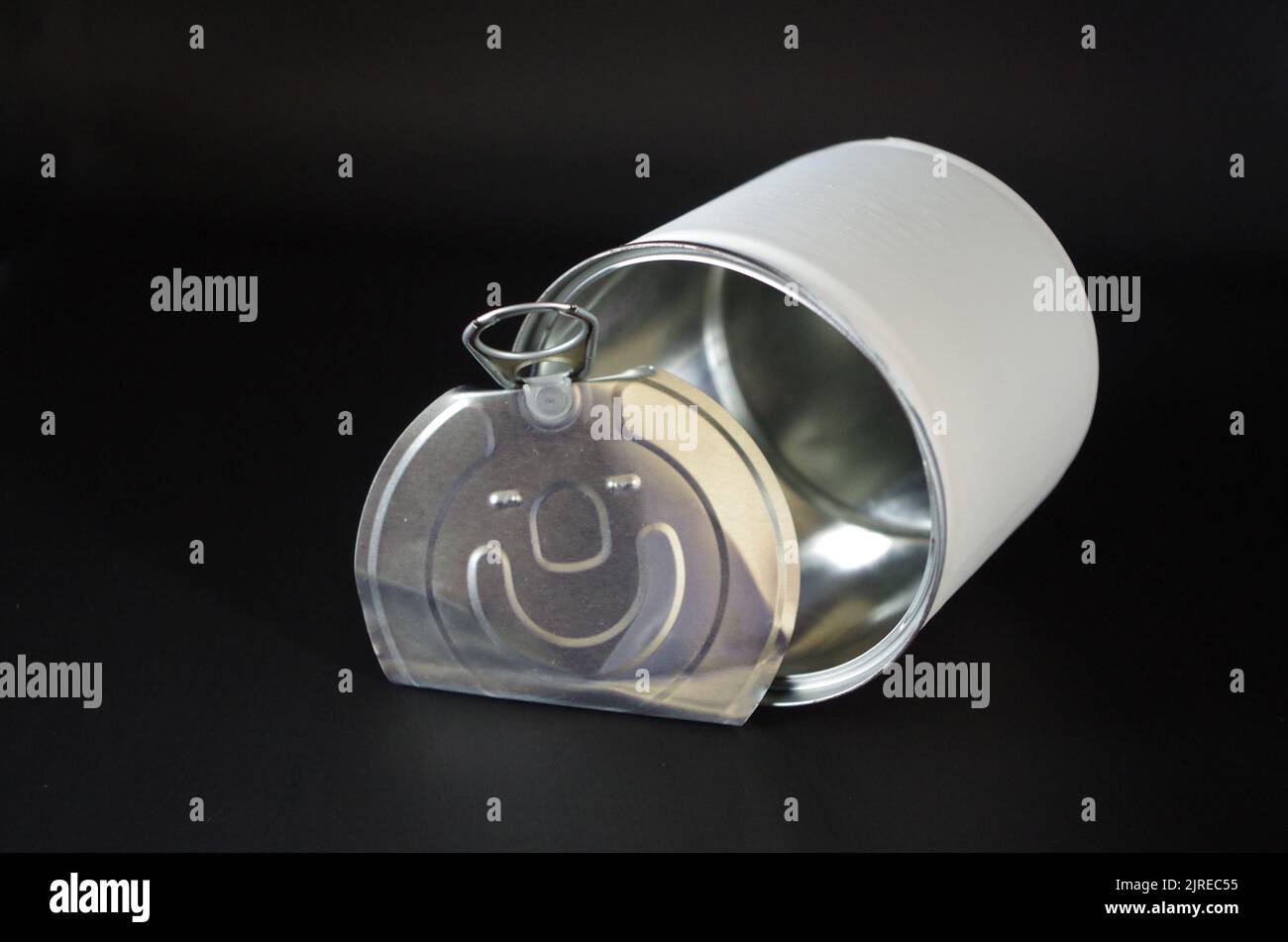 Metal Can with an abstract face. Stock Photo