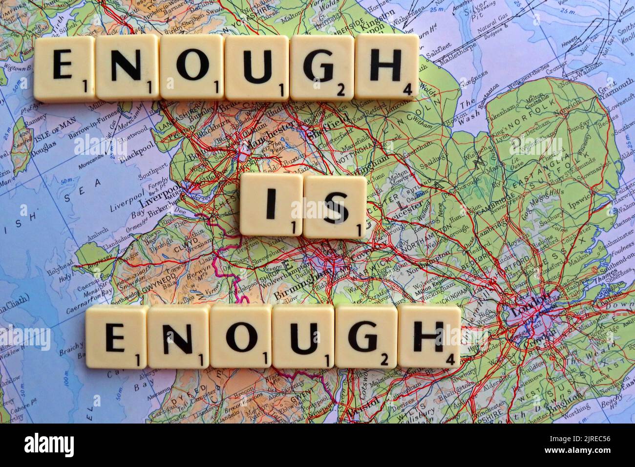 Enough Is Enough, scrabble letters on a map of the UK Stock Photo