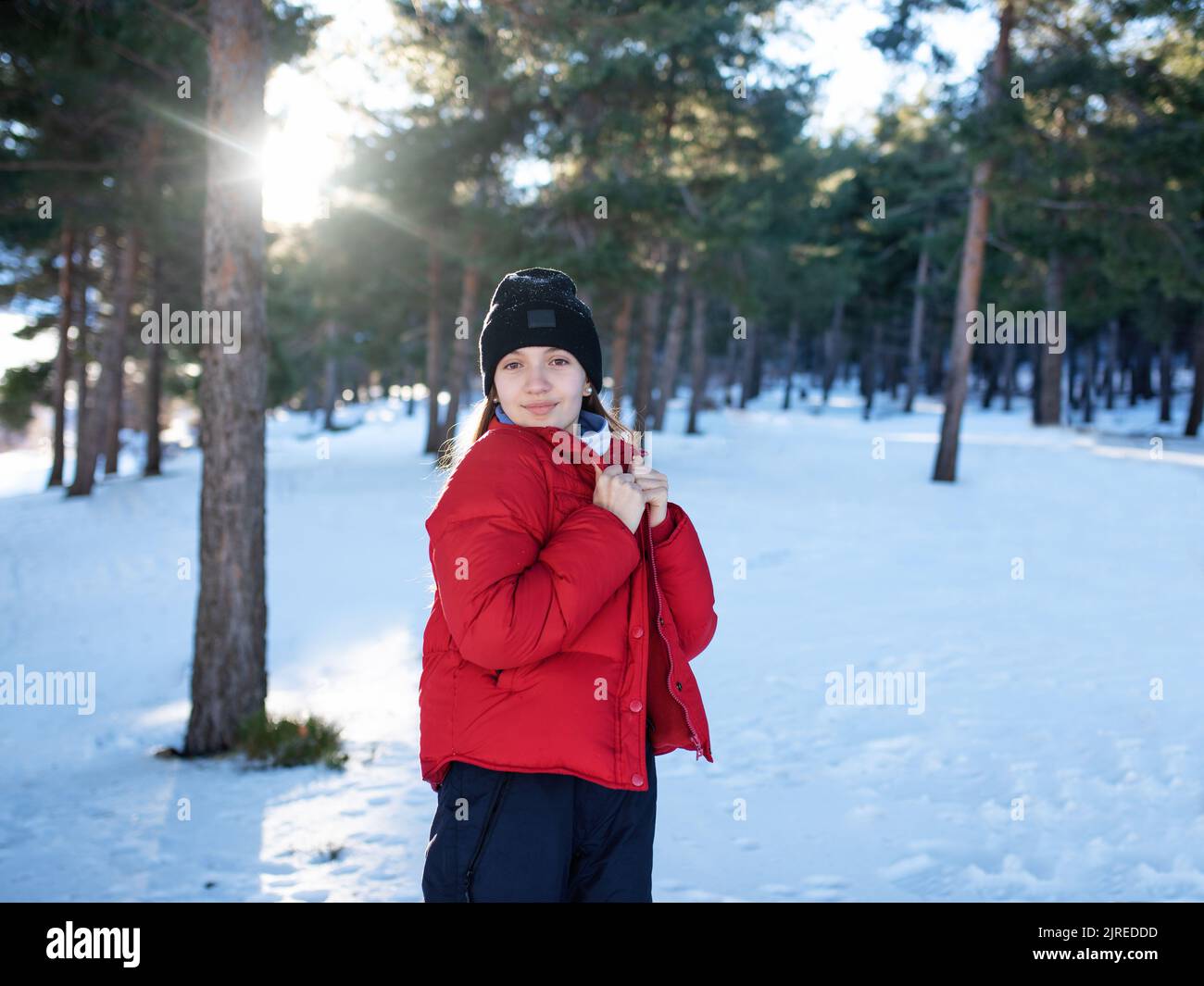 Beautiful happy laughing young girl dressed in winter clothes. Stock Photo