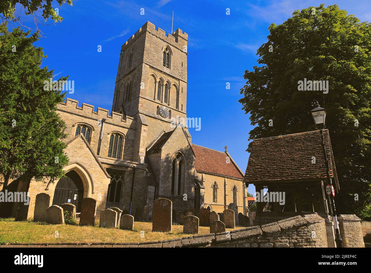 Felmersham, Bedfordshire, UK - St Mary's church with its pretty lychgate and churchyard on a sunny day in summer Stock Photo