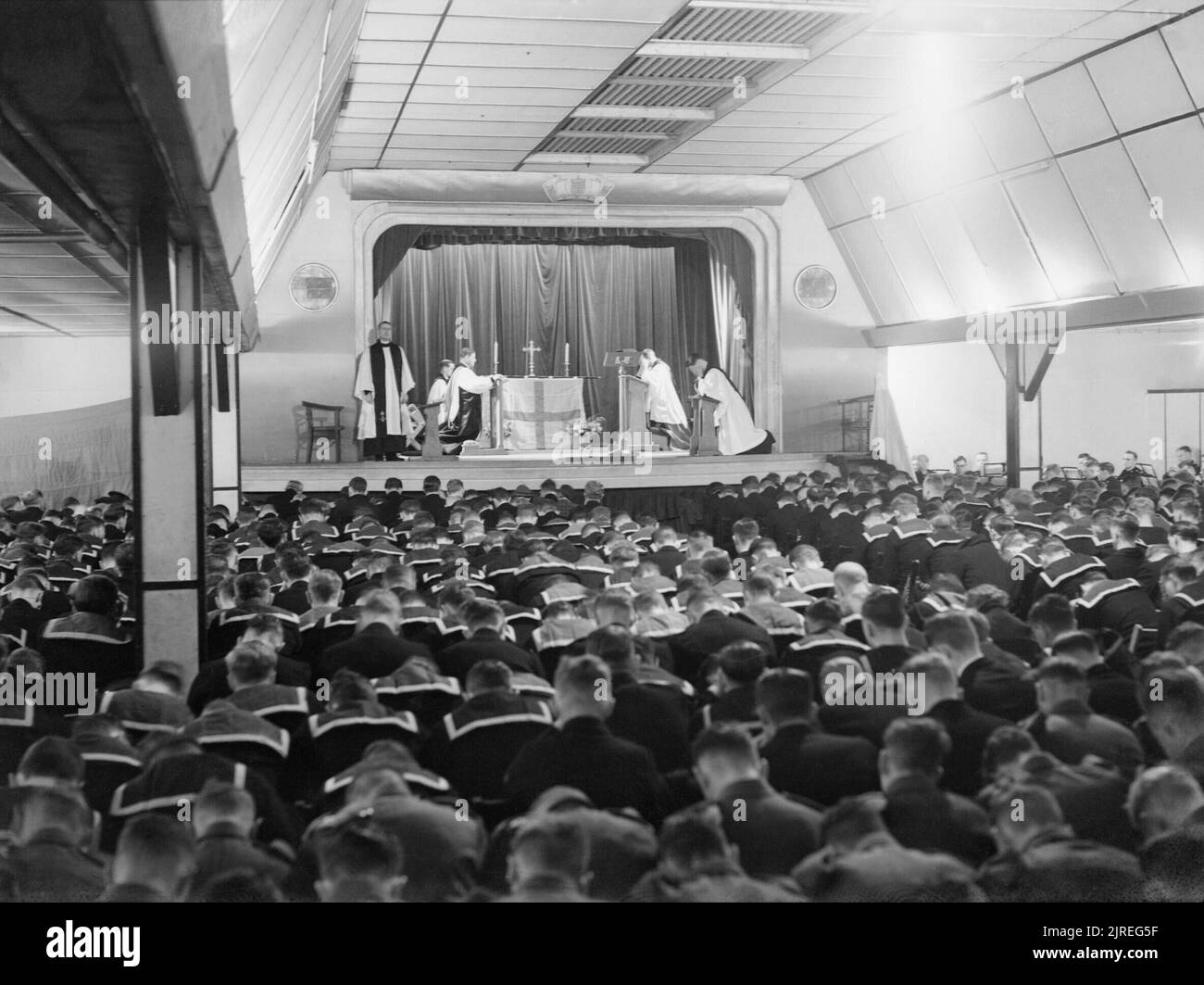 The Archbishop of Canterbury conducts a service in the cinema at Flotta on Orkney during his visit to the Home Fleet at Scapa Flow, 6 September 1942. A general view of the service carried out by the Archbishop of Canterbury in the cinema at Flotta on The Orkneys during his visit to the Home Fleet at Scapa Flow. Stock Photo