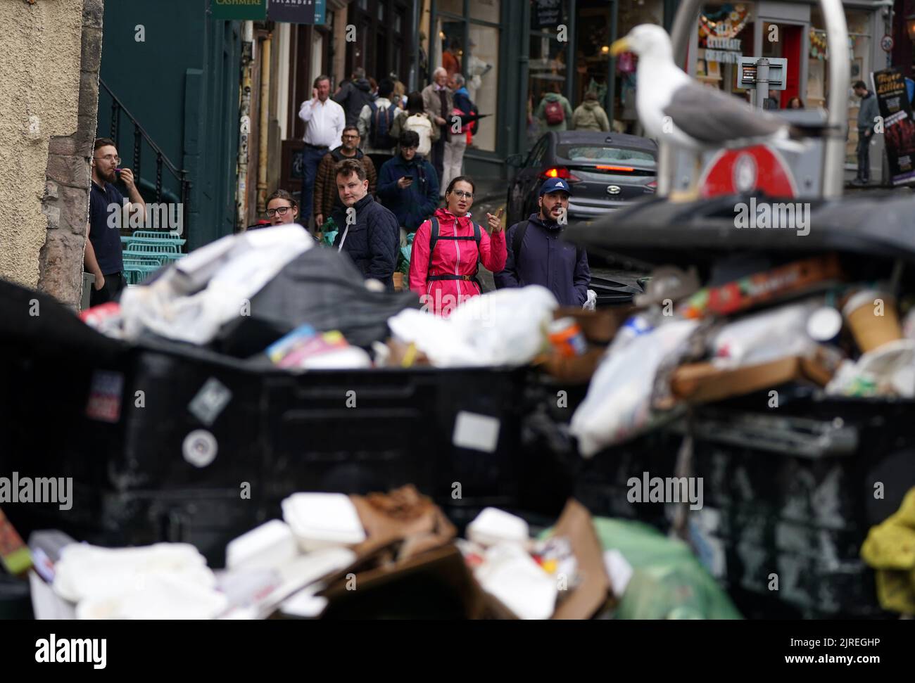 Overflowing bins in the Grassmarket area of Edinburgh where cleansing workers from the City of