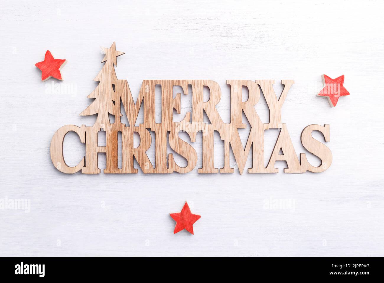 Merry Christmas wooden letters, festive decoration, greetings card template Stock Photo