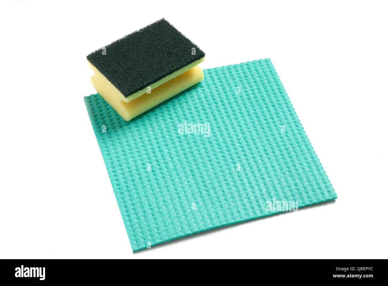 Cleaning cloth and sponge scouring pad, cut out on white. Stock Photo