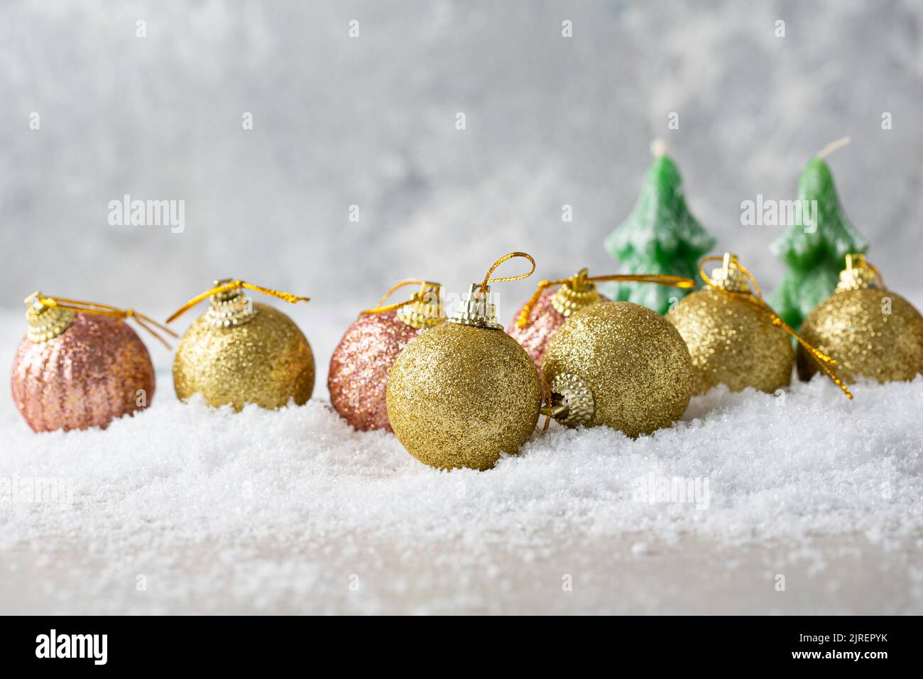 Christmas tree candles and decorations on snow fholiday concept Stock Photo