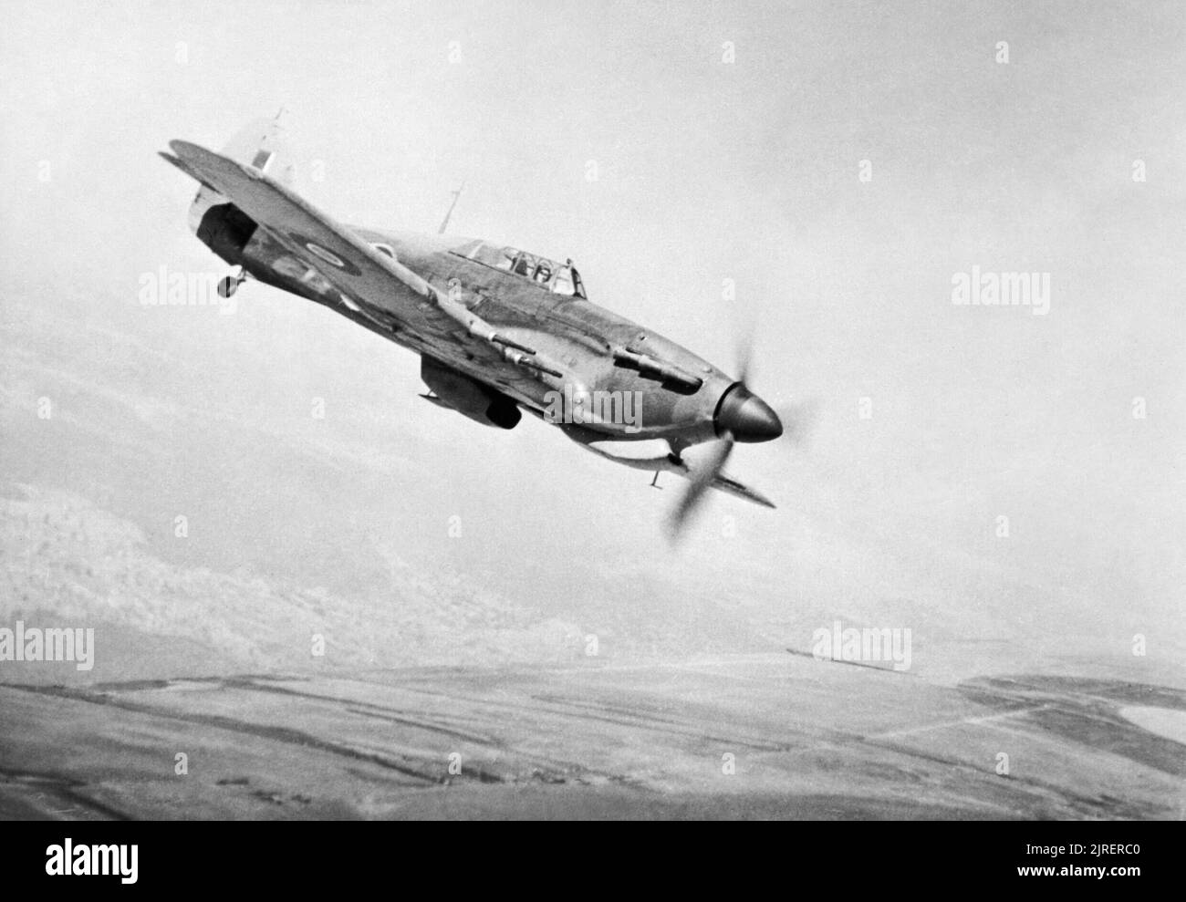 Hawker Hurricane Mk IIC of No. 166 Wing in flight from Chittagong in India, May 1943. A Hawker Hurricane Mark IIC of a squadron from No. 166 Wing RAF based at Chittagong, formates on the port quarter of the photographing aircraft. Stock Photo