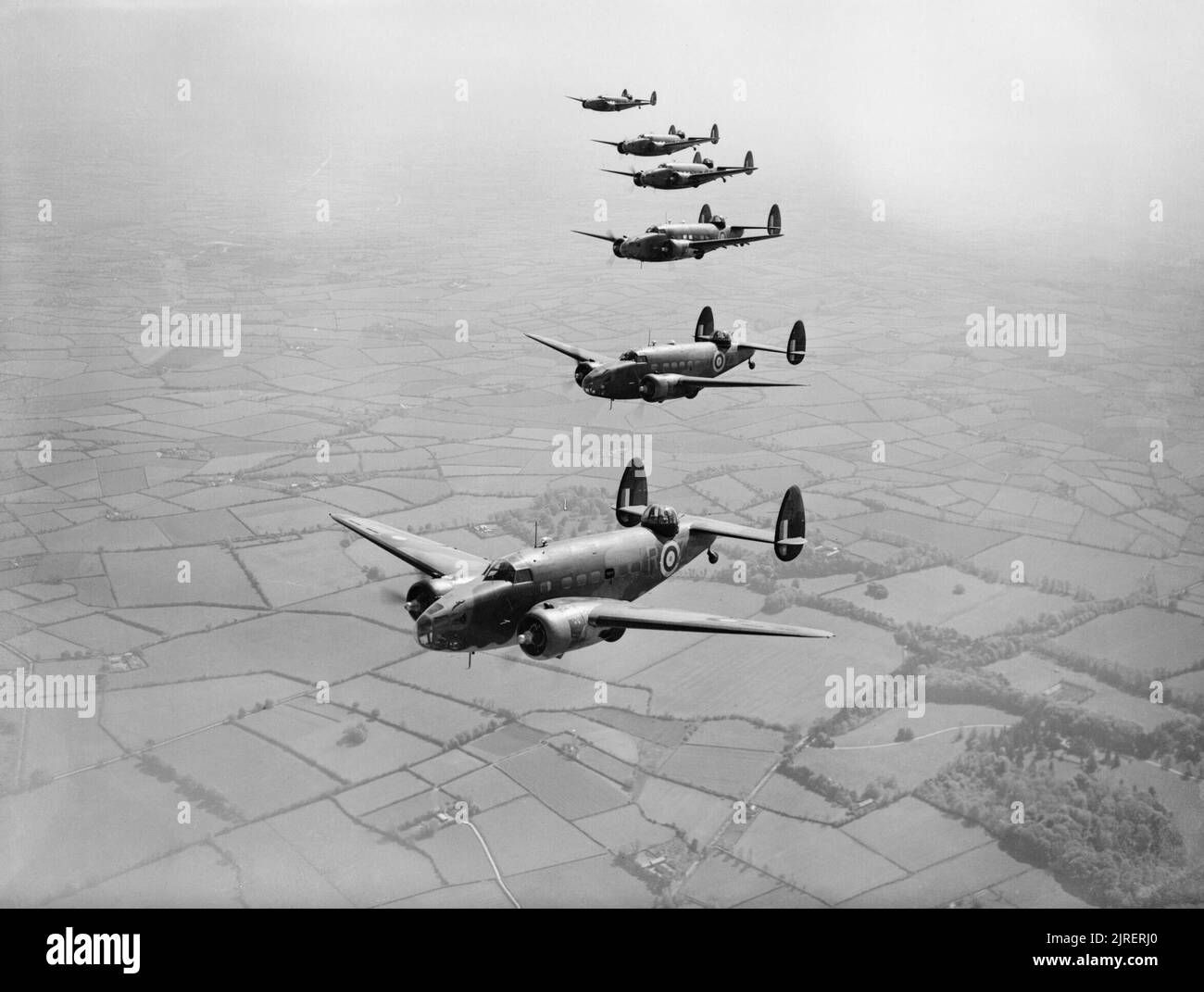 Lockheed Hudsons of No. 233 Squadron RAF based at Aldergrove in Northern Ireland, 30 May 1941. Lockheed Hudson Mark IIs and IIIs of No. 233 Squadron RAF based at Aldergrove, County Antrim, flying in starboard echelon formation over Northern Ireland. Stock Photo