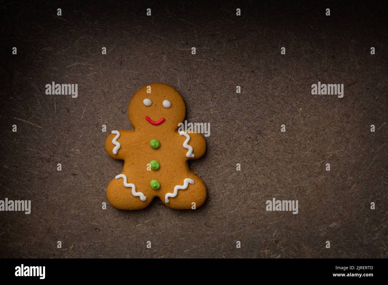 Top view of Christmas gingerbread man  cookies on dark surface Stock Photo