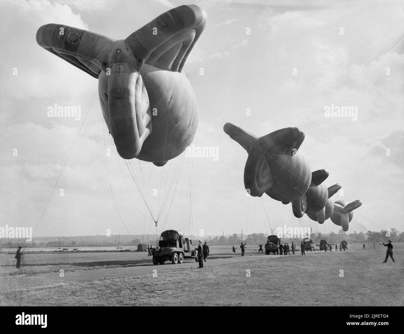 Royal Air Force Balloon Command, 1939-1945. Kite balloons and balloon winches of No. 1 Balloon Training Unit are prepared for handling practice at Cardington, Bedfordshire. Stock Photo