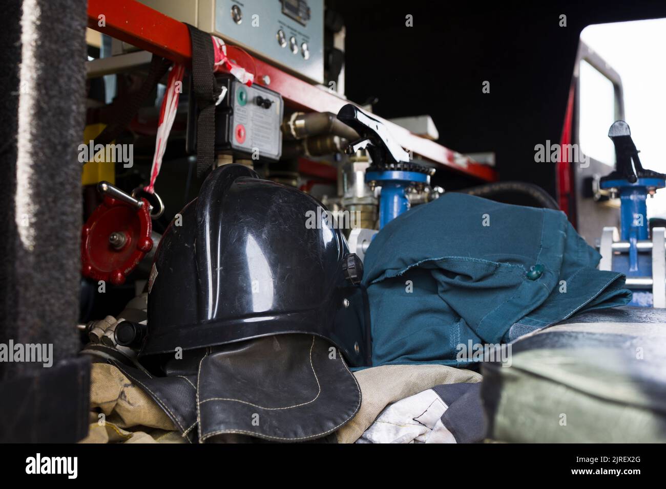Firefighter protection clothes in the Fire engine Stock Photo