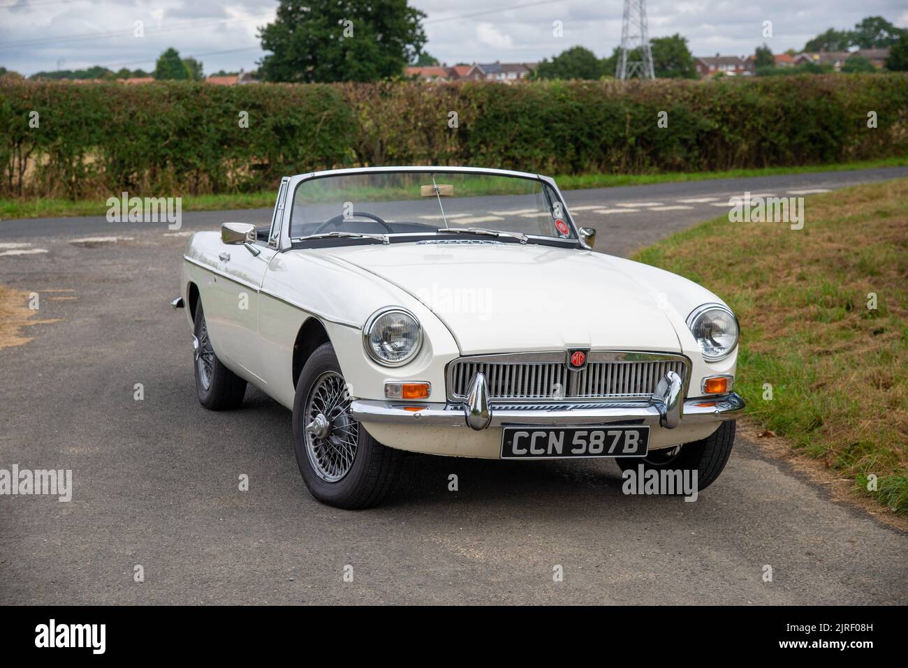 MGB roadster British classic car parked on a country lane in the Peak District, Derbyshire, UK Stock Photo