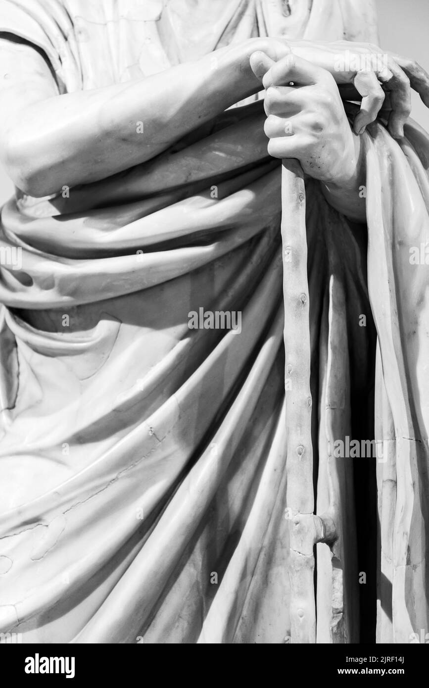 Black and white photo showing in detail the arms of ancient roman