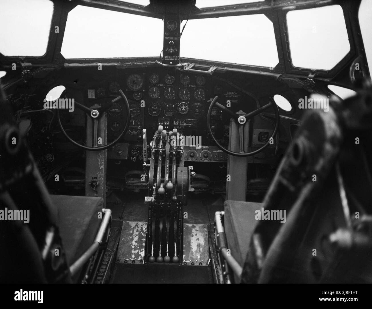 The pilots' instrument panel and flight controls of a Short Stirling Mk I of No. 7 Squadron RAF at Oakington, Cambridgeshire, February 1942. View of the instrument panel and controls in the cockpit of a Short Stirling Mark I of No. 7 Squadron RAF at Oakington, Cambridgeshire. Stock Photo