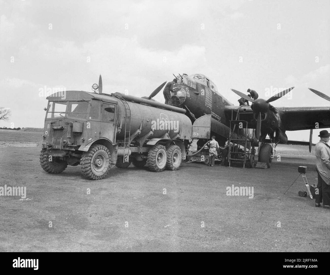 The Royal Air Force during the Second World War The Avro Lancaster B I R5868 'S-Sugar' refuels at RAF Hunsdon after completing its 100th operation the previous evening against Bourg Leopold in Belgium on 12 May 1944. The 2500 gallon tank truck is AEC 854. Stock Photo