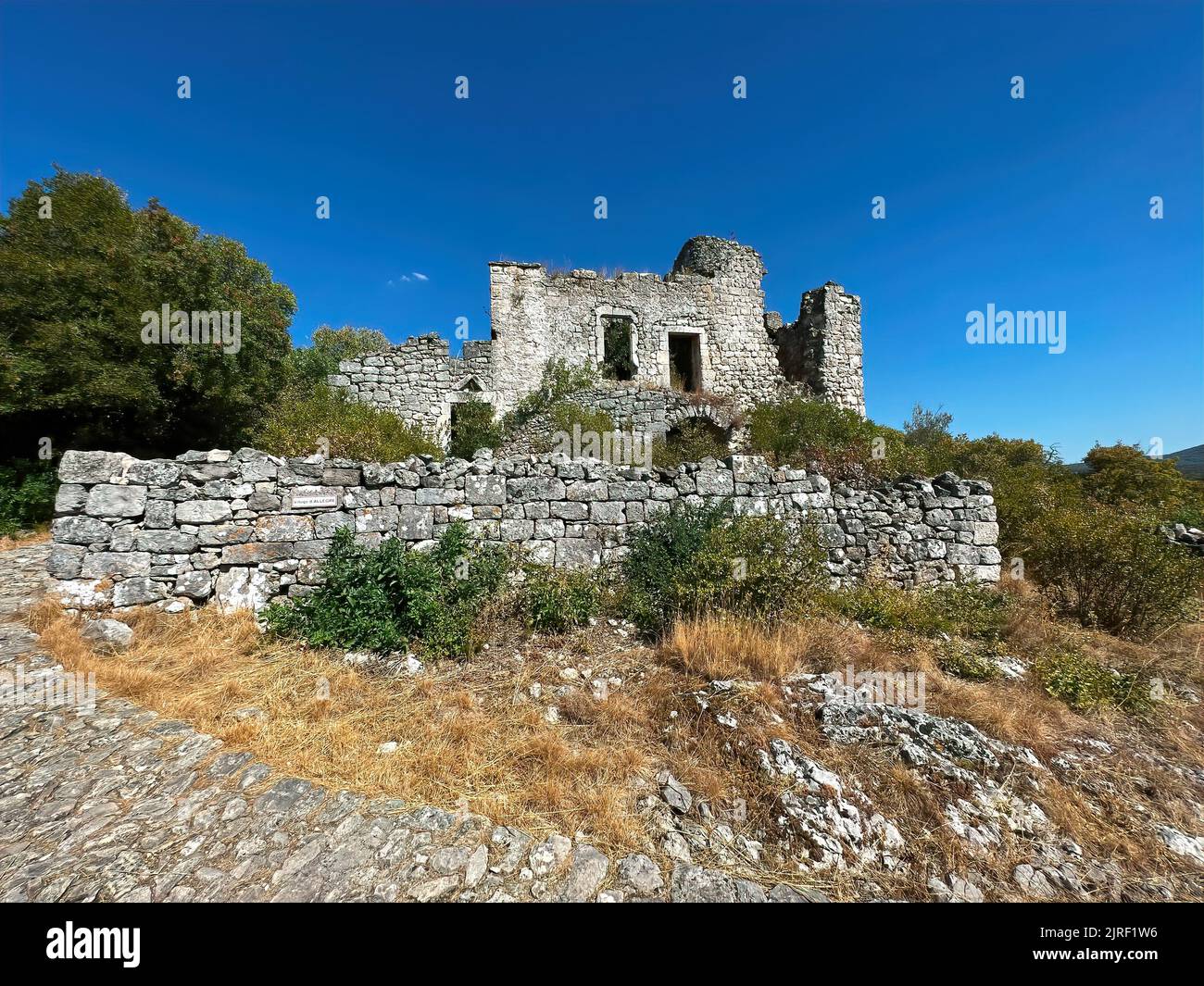 Scenic shot at the ruins of the old medieval Templar vestige, fortress at Allegre les fumades, Gard, France under a blue mediterranean sunny sky Stock Photo