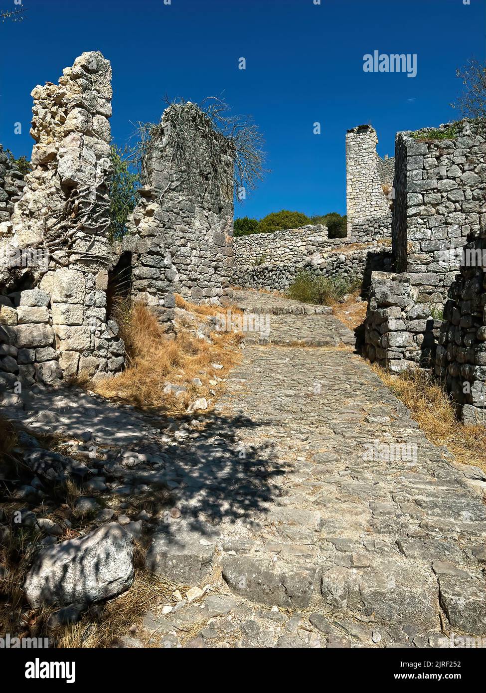 Scenic shot at the ruins of the old medieval Templar vestige, fortress at Allegre les fumades, Gard, France under a blue mediterranean sunny sky Stock Photo