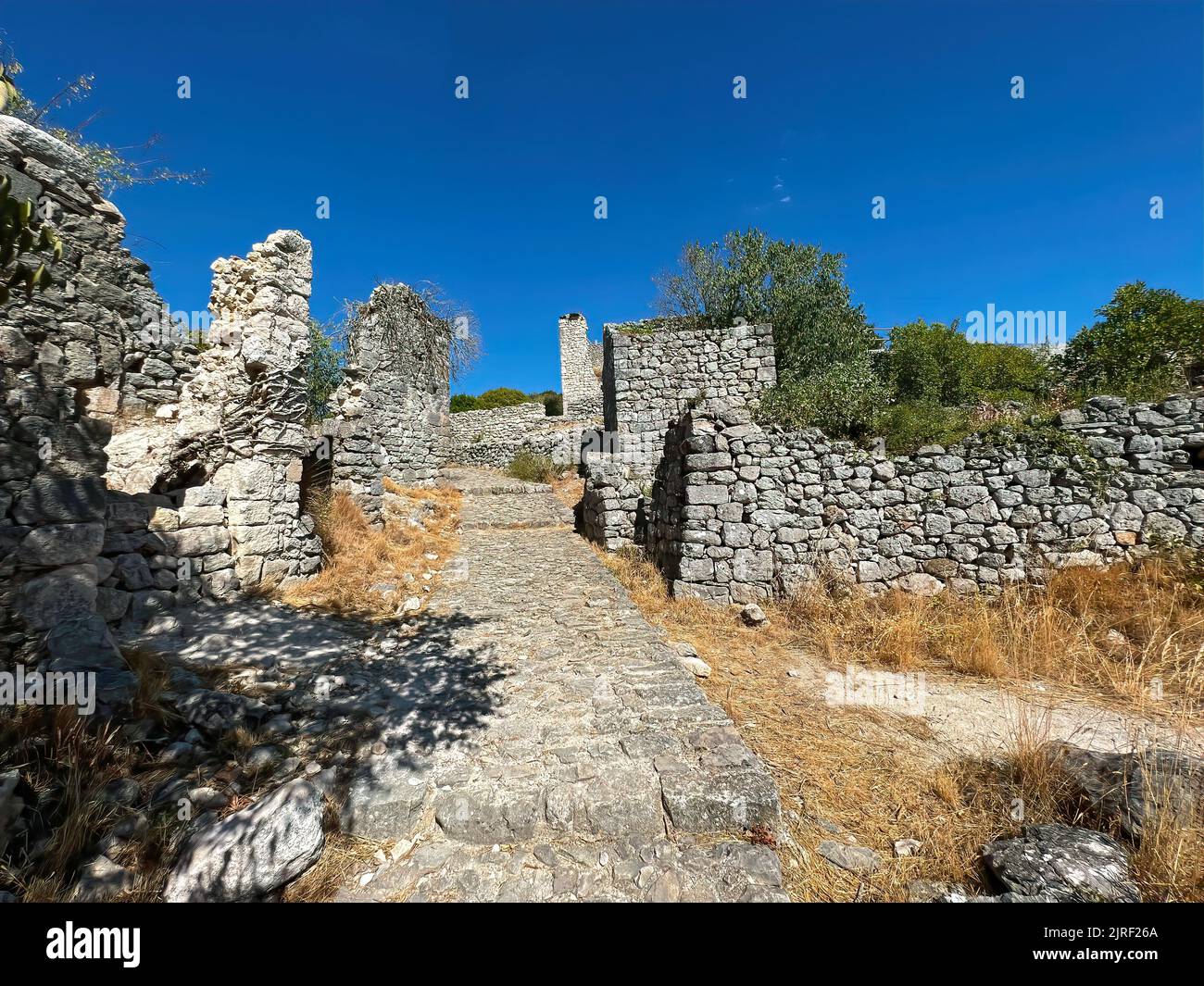 Scenery of the old medieval Templar vestige , fortress ruins at Allegre les fumades, Gard, France under a blue sunny sky Stock Photo
