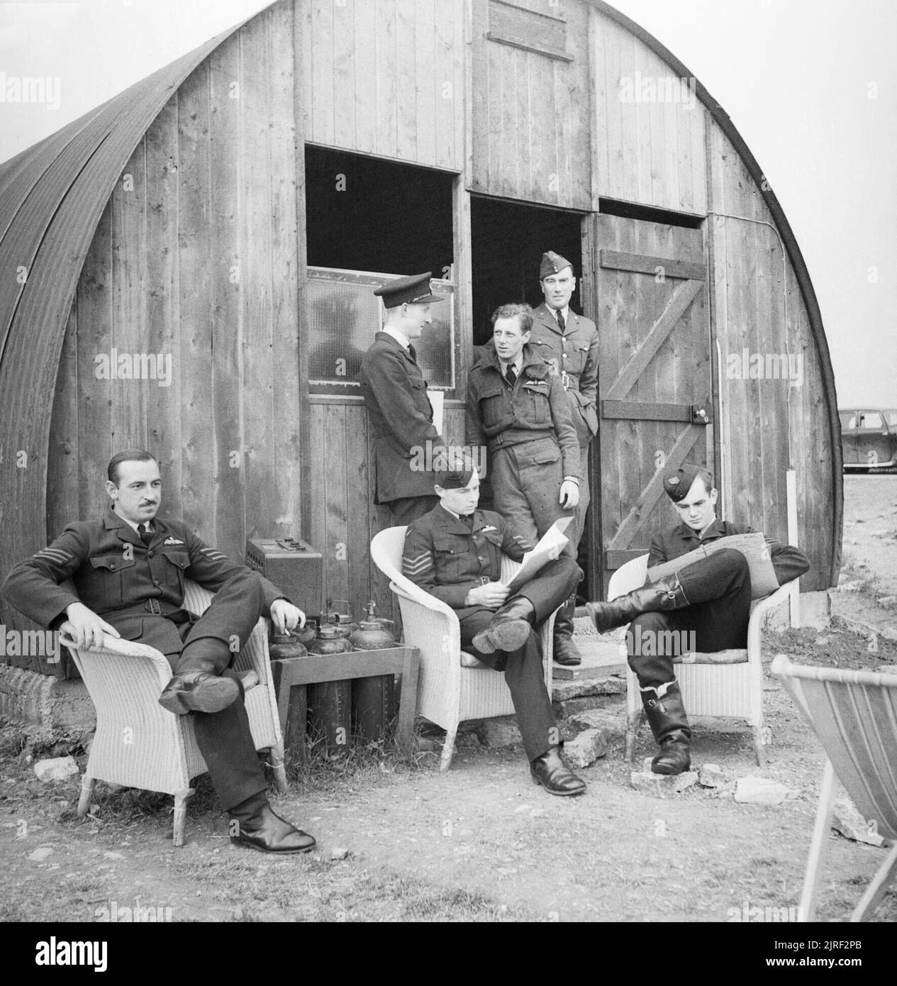 Australian pilots of No. 452 Squadron relax outside their dispersal hut at Kirton-in-Lindsey, 18 June 1941. Australian pilots of No. 452 Squadron relax outside their dispersal hut at Kirton-in-Lindsey, 18 June 1941. Stock Photo