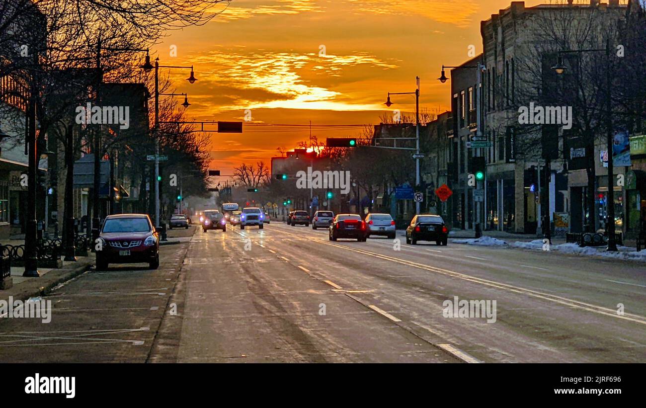 A beautiful view of College Avenue traffic at dawn with an orange sky Stock Photo