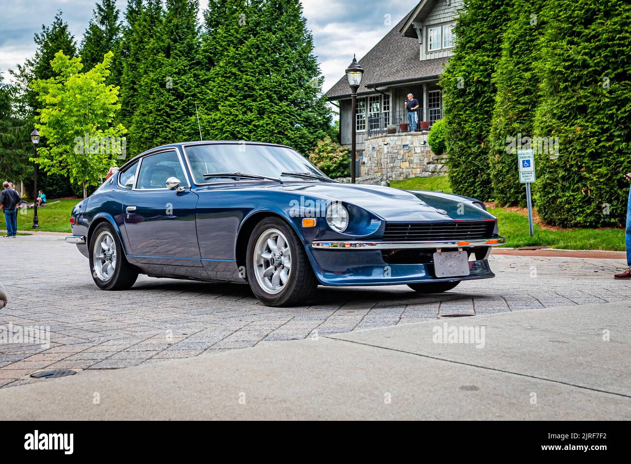 Highlands, NC - June 10, 2022: Low perspective front corner view of a 1974 Datsun 240Z Hardtop Coupe leaving a local car show. Stock Photo