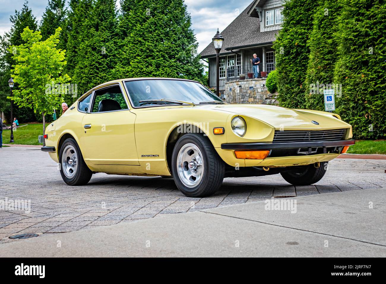 Highlands, NC - June 10, 2022: Low perspective front corner view of a 1971 Datsun 240Z Hardtop Coupe leaving a local car show. Stock Photo